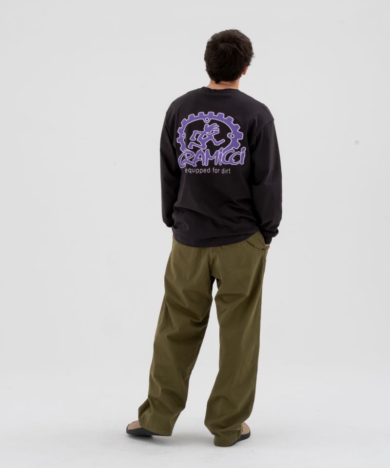 Back view of a Model wearing olive green Gramicci Pants and a Gramicci Dirt Long-Sleeve-Tee on a light-tone background.
