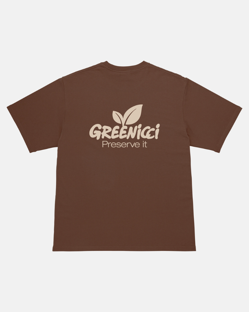 Back view of a Gramicci brown colored Gramicci Greenicci Tee with a tan Greenicci graphic against a light-tone background.