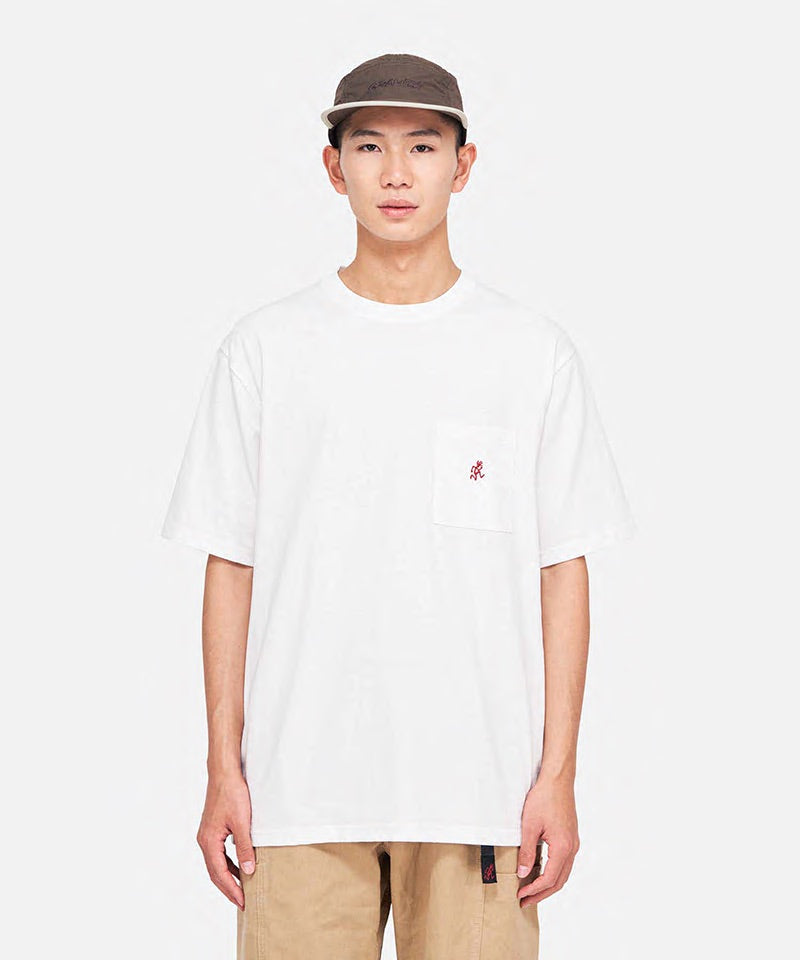 Model wearing a Gramicci white One Point Tee with a small running man graphic against a light-tone background.