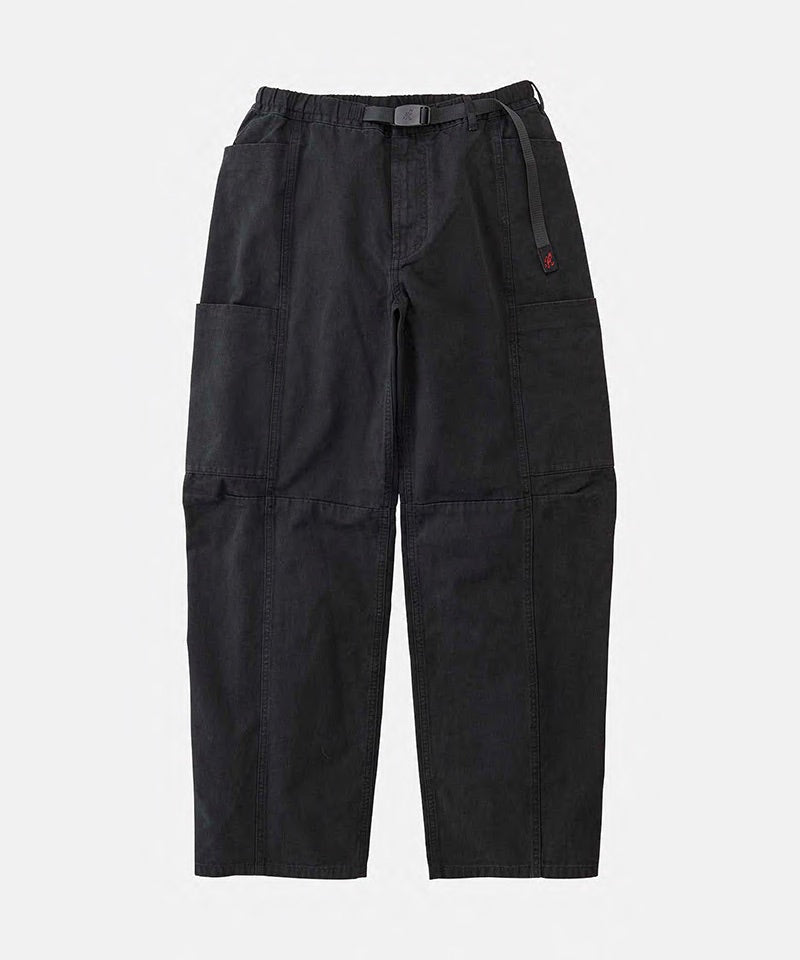 Black Gramicci Voyager Pants with a belt against a light-tone background.