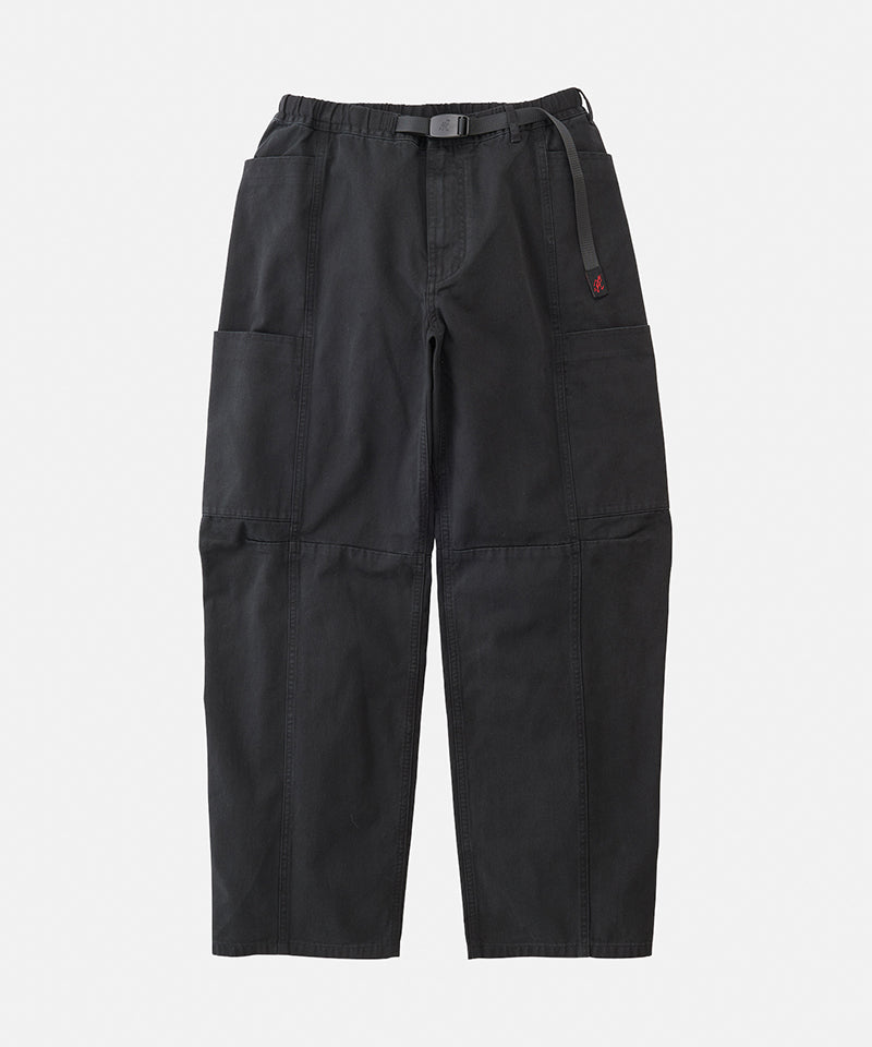 Black Gramicci Voyager Pants with a belt against a light-tone background.