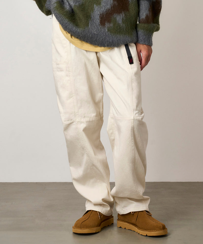 Model wearing greige colored Gramicci Voyager Pants and a mohair sweater on a light-tone background.