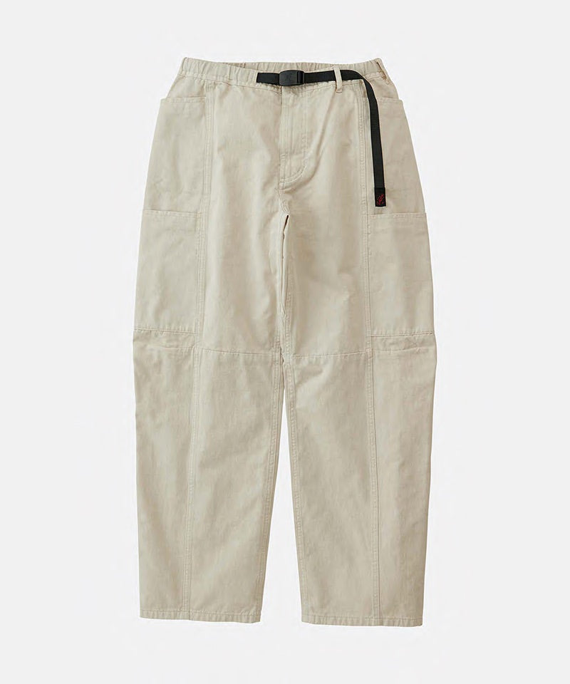 Greige colored Gramicci Voyager Pants with a belt against a light-tone background.