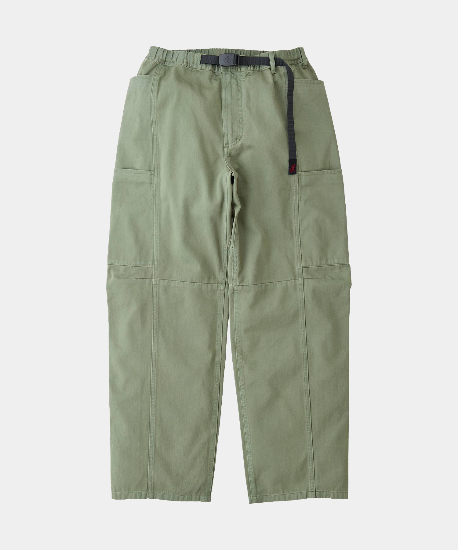 Sage colored Gramicci Voyager Pants with a belt against a light-tone background.