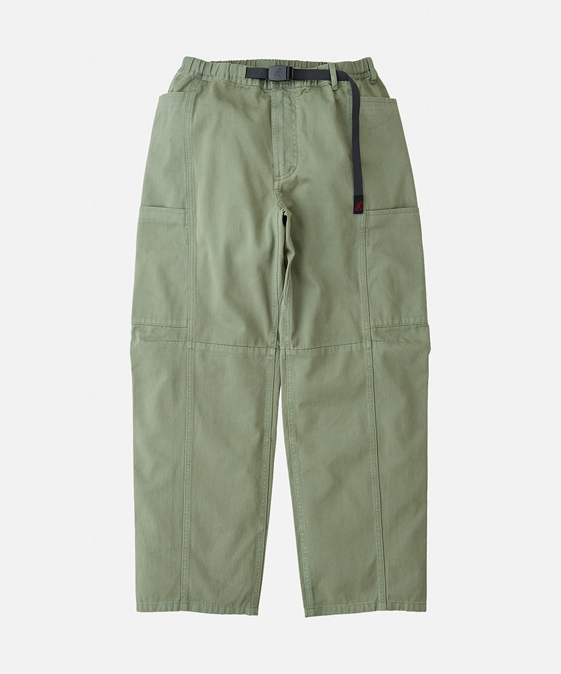 Sage colored Gramicci Voyager Pants with a belt against a light-tone background.