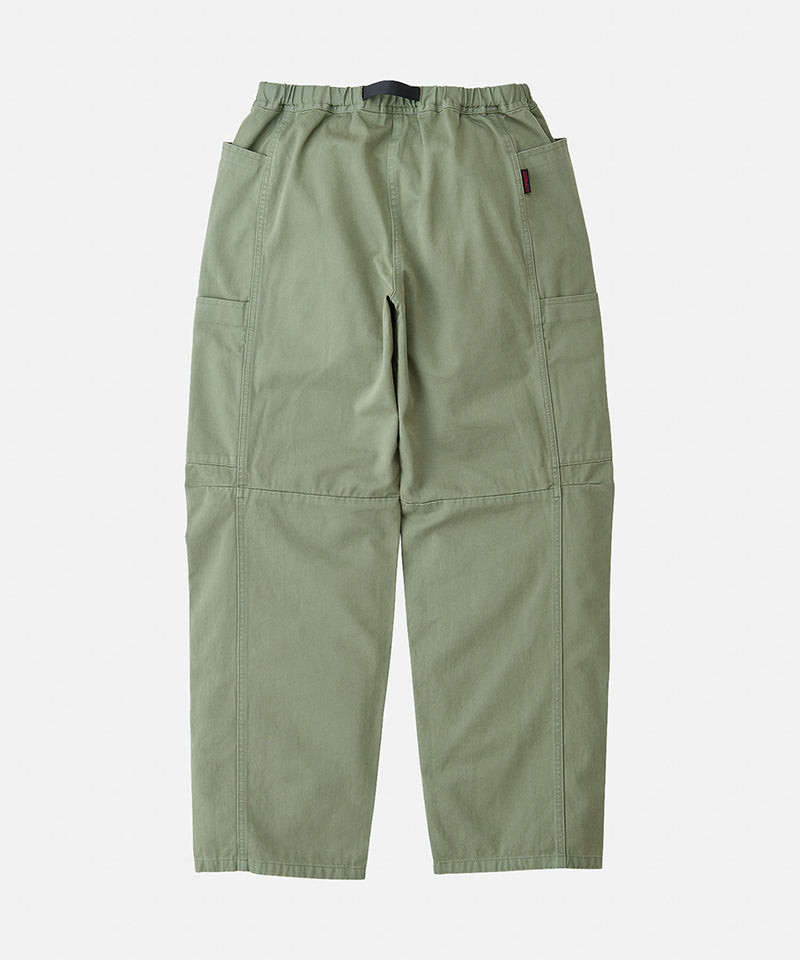 Back view of sage colored Gramicci Voyager Pants on a light-tone background.