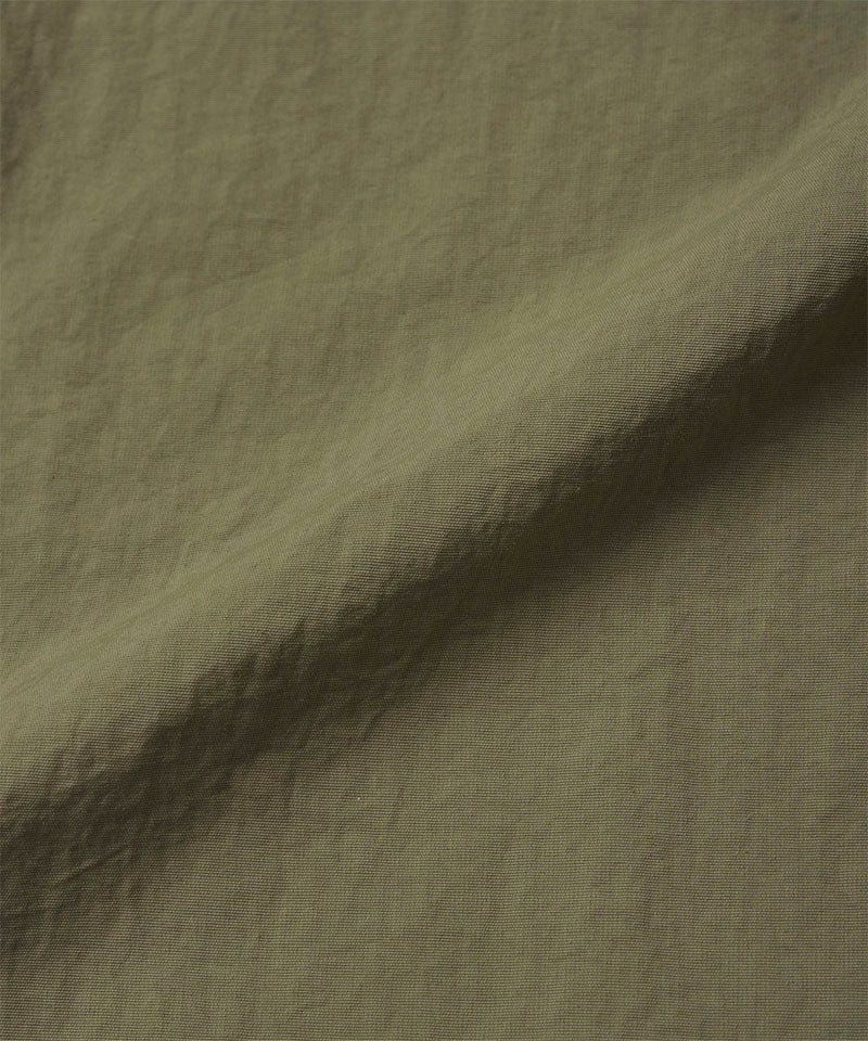 Burnt olive colored colored Nylon Gramicci Pants fabric swatch.