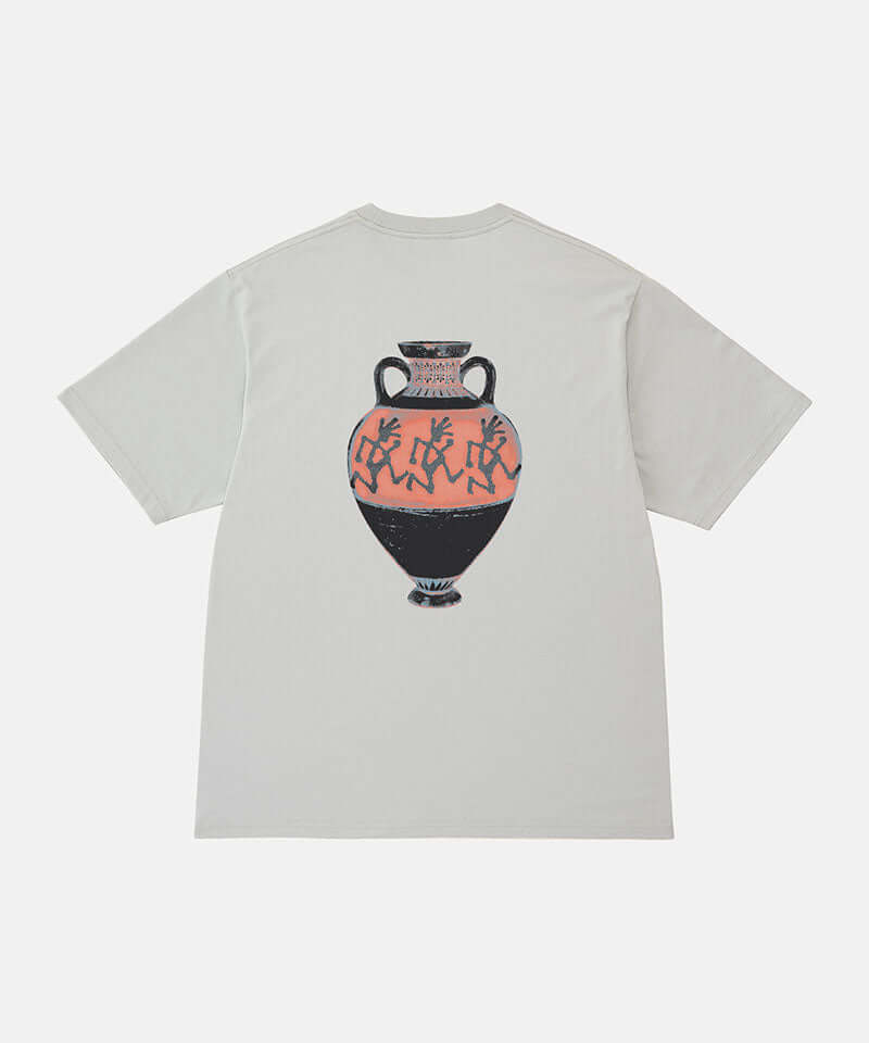 Back view of a Gramicci mist colored Vase Tee with a graphic against a light-tone background.