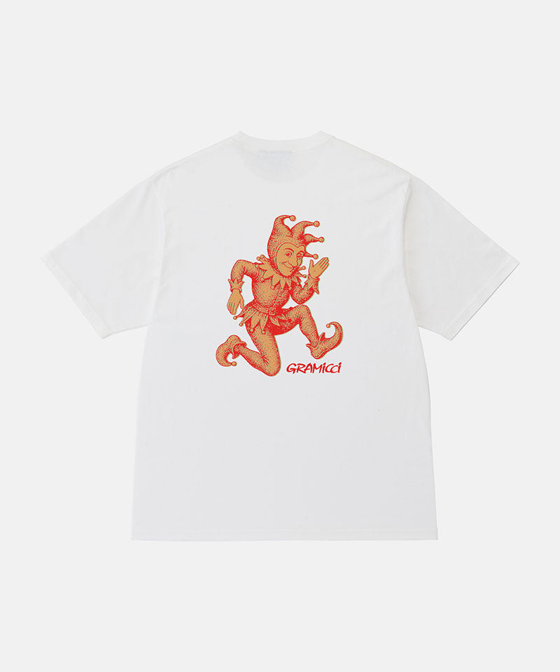 Back view of a Gramicci white Joker Tee with an orange graphic against a light-tone background.