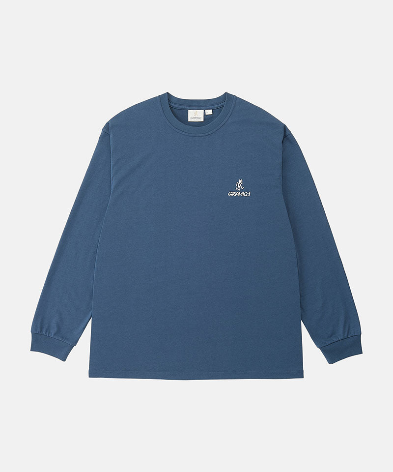 Model wearing a Gramicci dusky blue One Point Logo Long Sleeve Tee with a graphic against a light-tone background.
