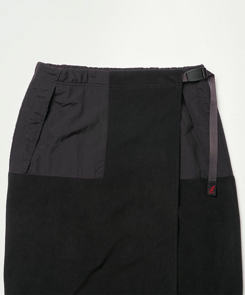 Close-up view of a black Gramicci Thermal Fleece Skirt against a light-tone background.