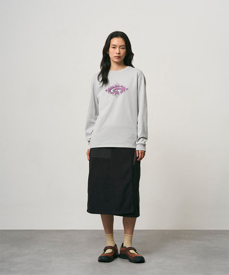 Model wearing a black Gramicci Thermal Fleece Skirt and a grey sweatshirt on a light-tone background.