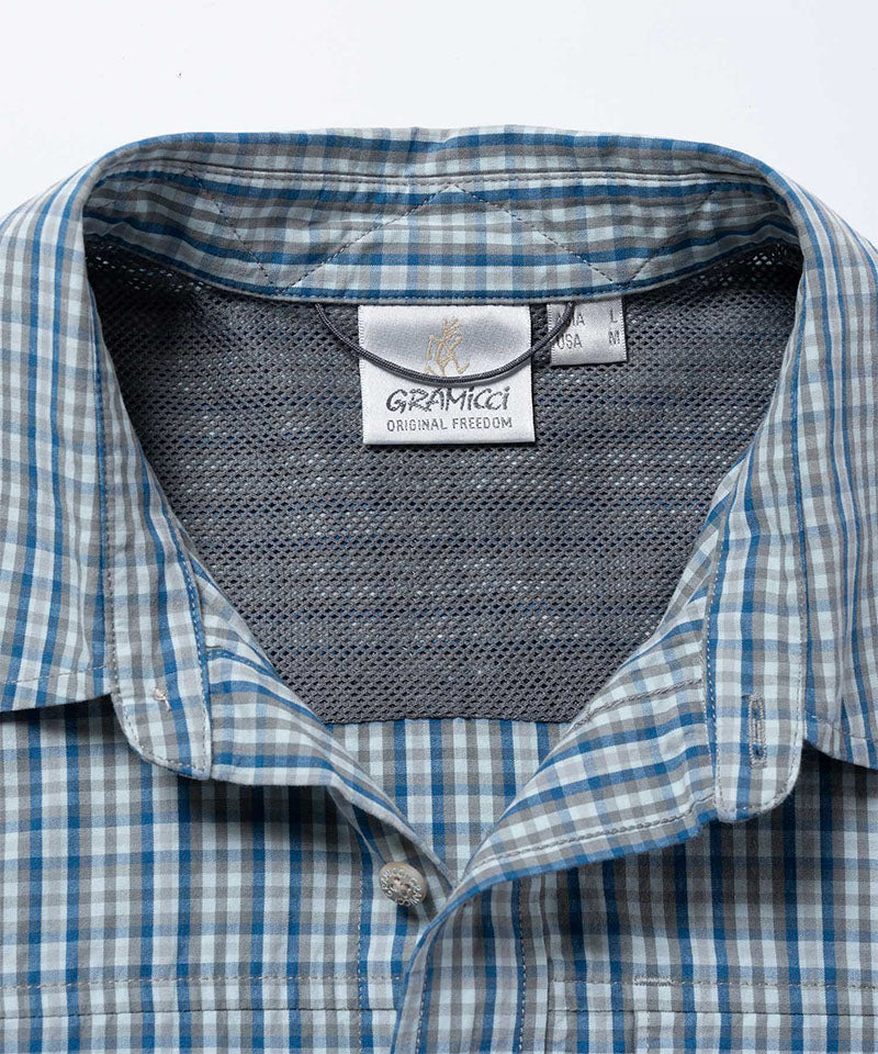 Gramicci blue plaid Poplin Millwood Shirt collar detail against a light-tone background.