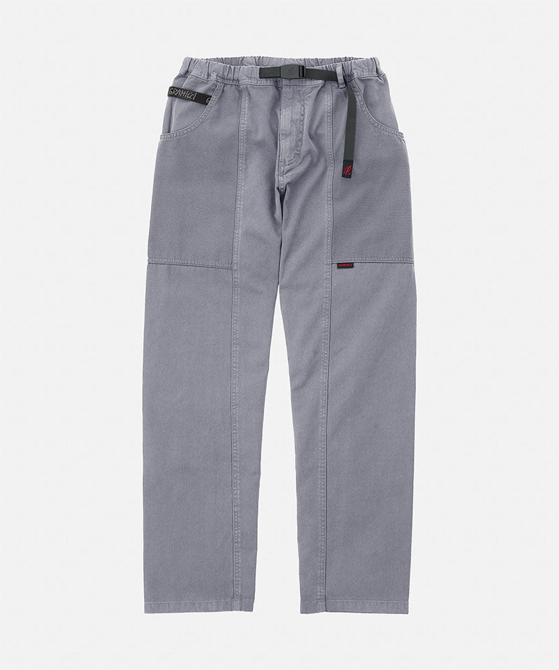 Gramicci natural dyed grey Gadget Pants with a black belt against a light-tone background.