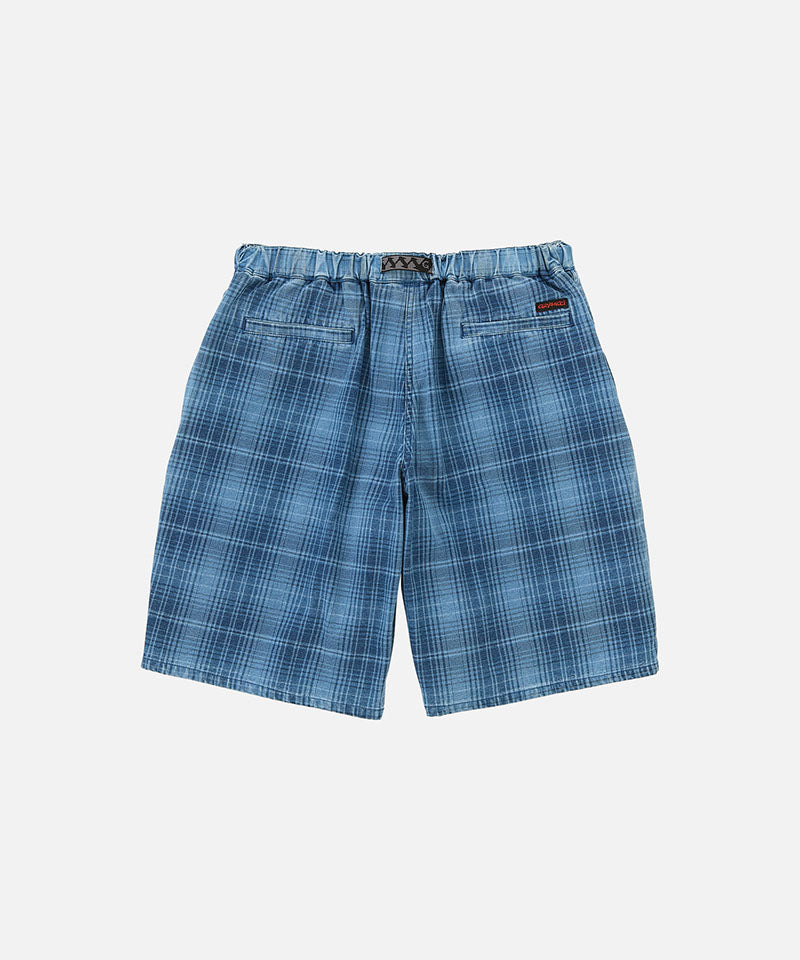 Back view of a Gramicci indego Lagoon Short Denim Plaid against a light-tone background.