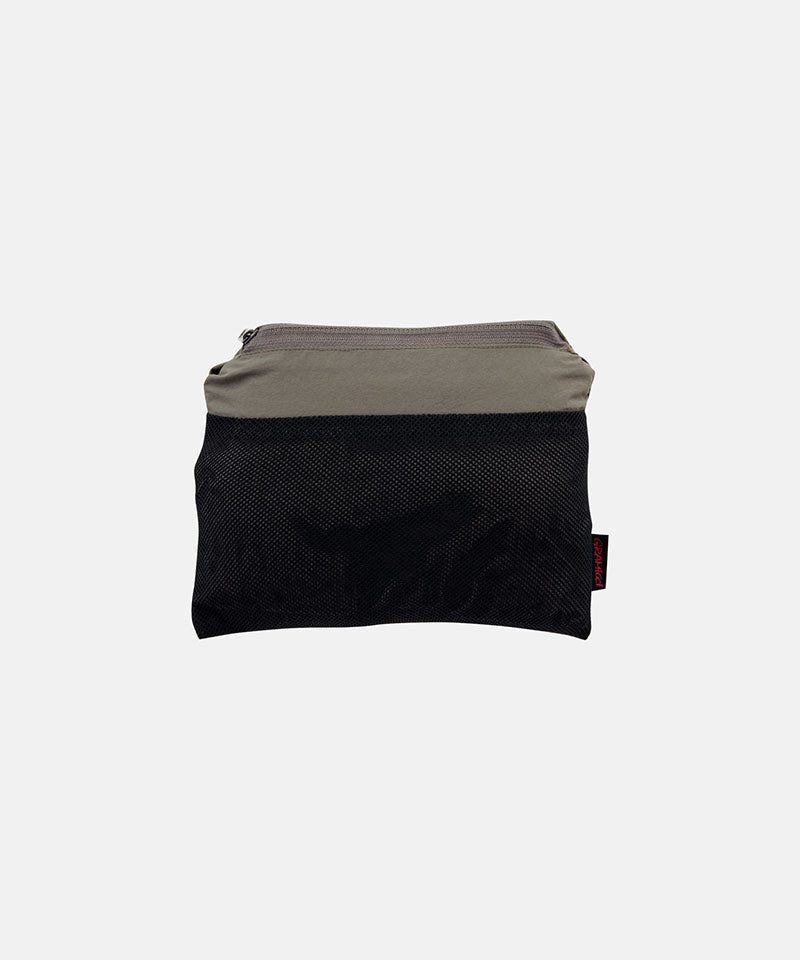 Jade green Gramicci Nylon Block Shorts inside carrying pouch against a light-tone background.