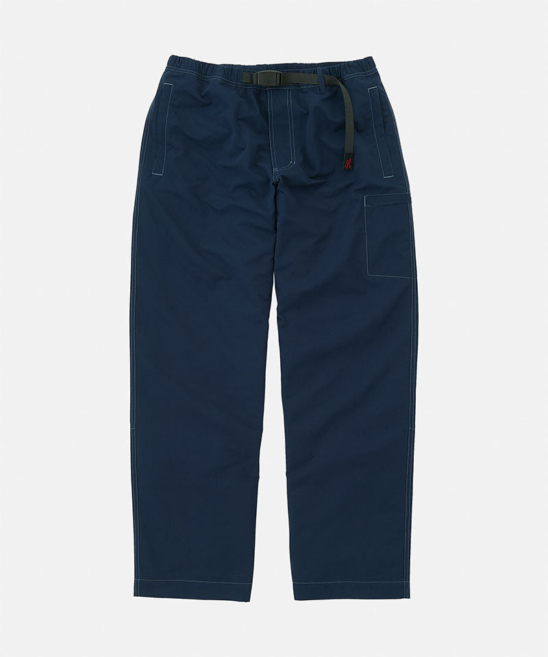 Gramicci Milton Pant in dark navy with a black belt against a light-tone background.