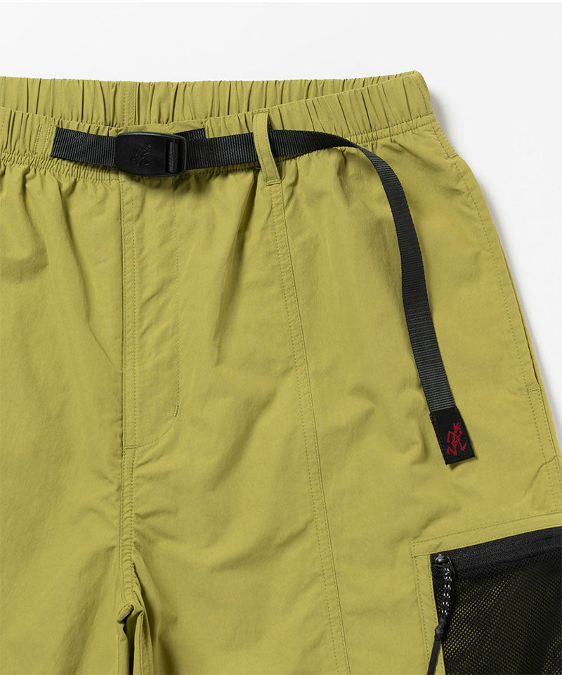Close-up of Gramicci Guide Shorts in the color field green against a light-tone background.