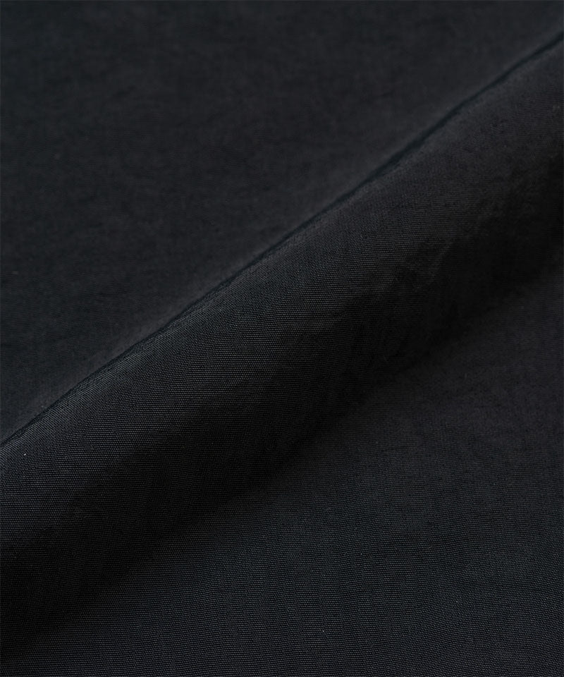 Black colored Gramicci Nylon Paneled Trek Pants fabric swatch.