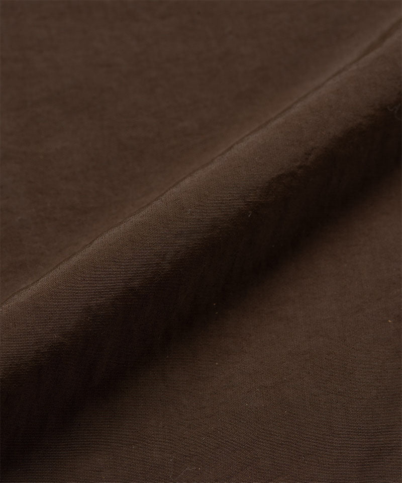 Chocolate colored colored Gramicci Nylon Paneled Trek Pants fabric swatch.