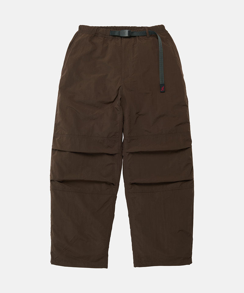 Chocolate colored Gramicci Nylon Paneled Trek Pants with a belt against a light-tone background.
