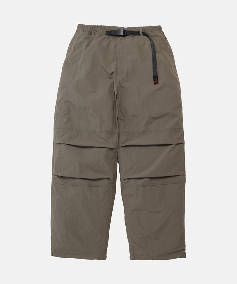 Granite colored Gramicci Nylon Paneled Trek Pants with a belt against a light-tone background.