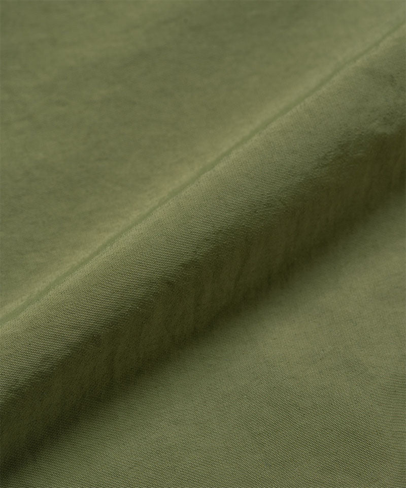Olive colored Gramicci Nylon Paneled Trek Pants fabric swatch.