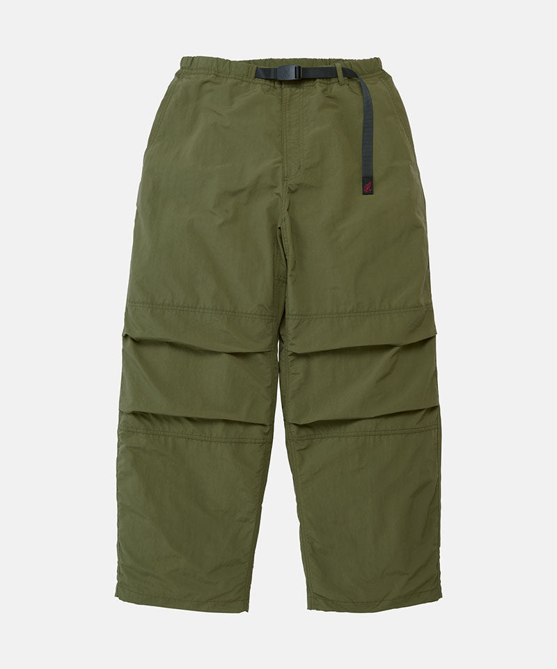Olive Gramicci Nylon Paneled Trek Pants with a belt against a light-tone background.