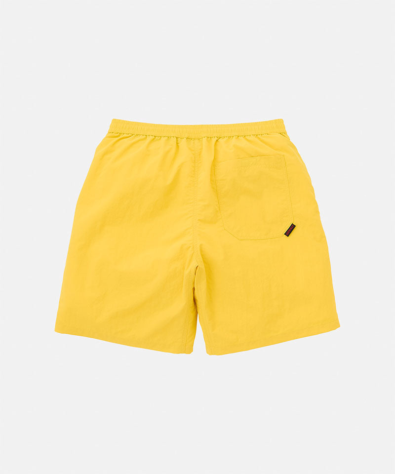 Back view of the banana colored Gramicci Nylon Reef Short against a light-tone background.