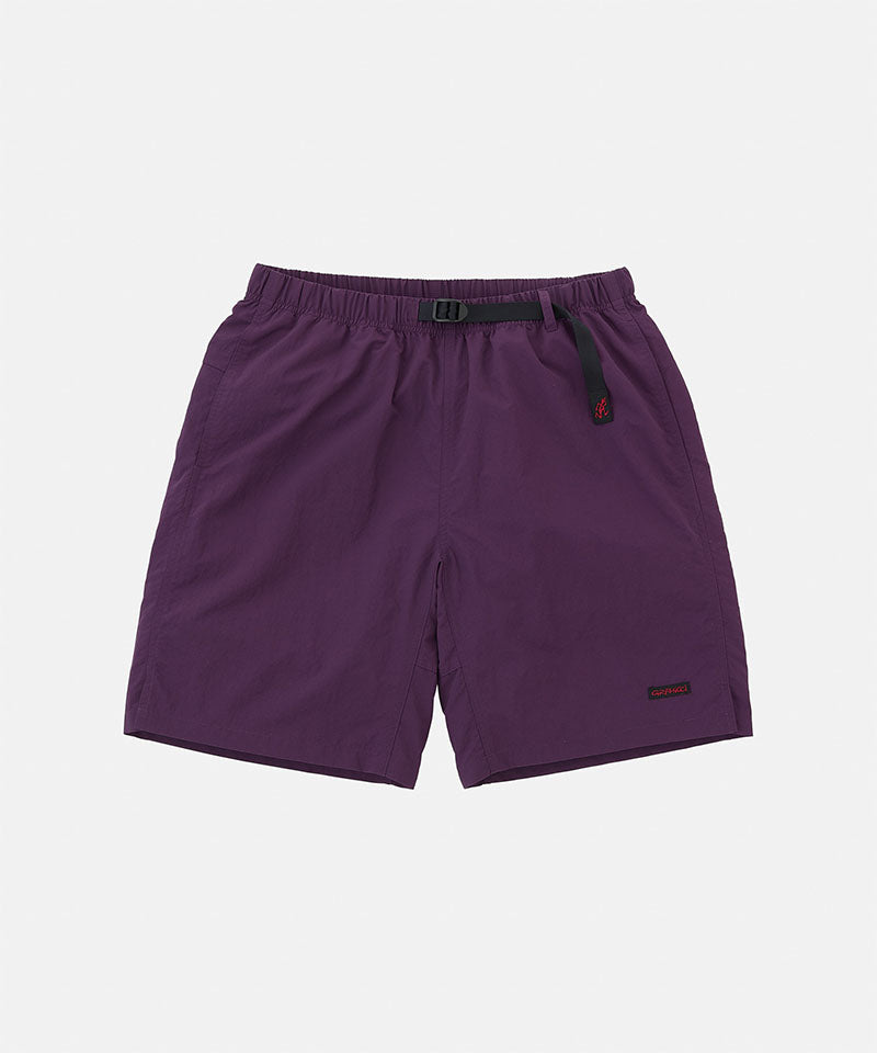 Deep purple Gramicci Nylon Packable G-Shorts with a belt against a light-tone background.