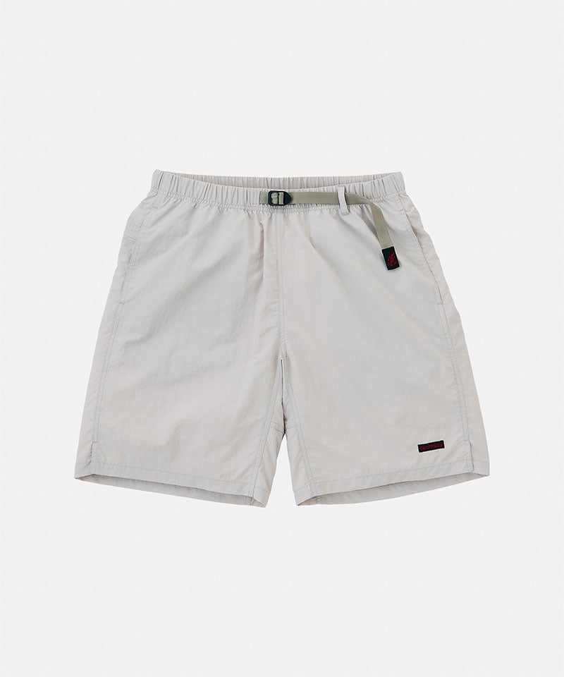 Ecru colored Gramicci Nylon Packable G-Shorts with a belt against a light-tone background.