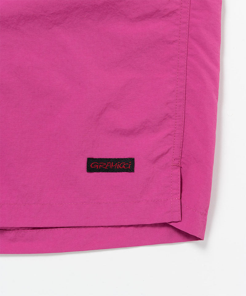 Bright plum colored Gramicci Nylon Packable G-Short hem showing the logo label on a light-tone background.