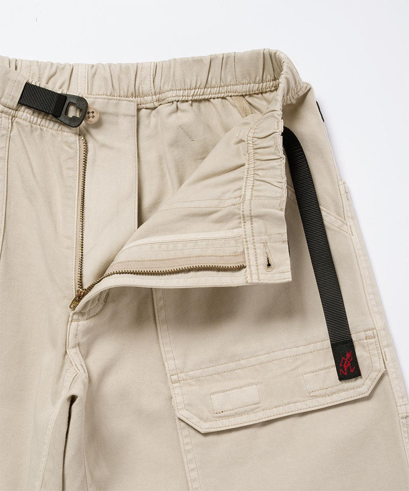 Close-up view of sand pigment Gramicci EQT Pant on a light-tone background.