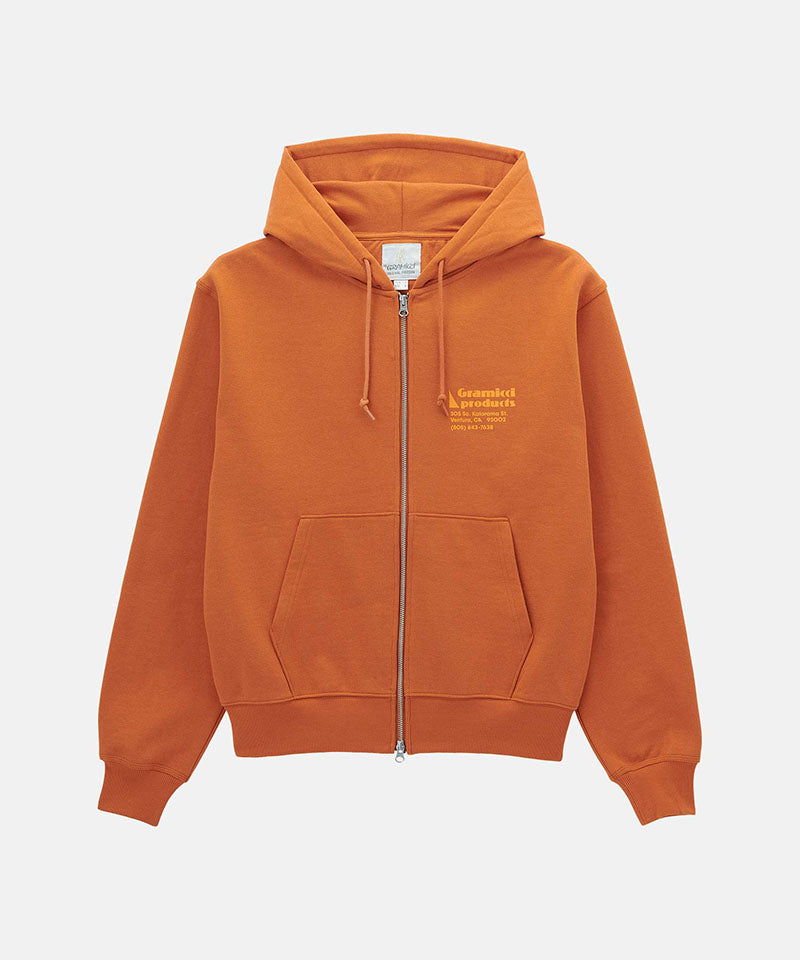 Back view of a Gramicci orange G-Sail Zip Hooded Sweatshirt with a light orange graphic against a light-tone background.
