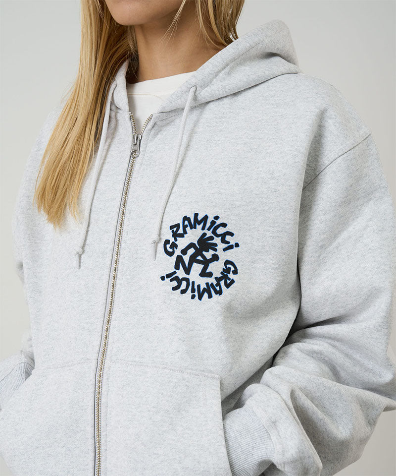 Model wearing heather ash Gramicci Running Man Zip Hooded Sweatshirt on a light-tone background.