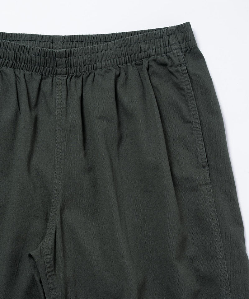 Close-up view of shadow colored Gramicci Swell Pant on a light-tone background.