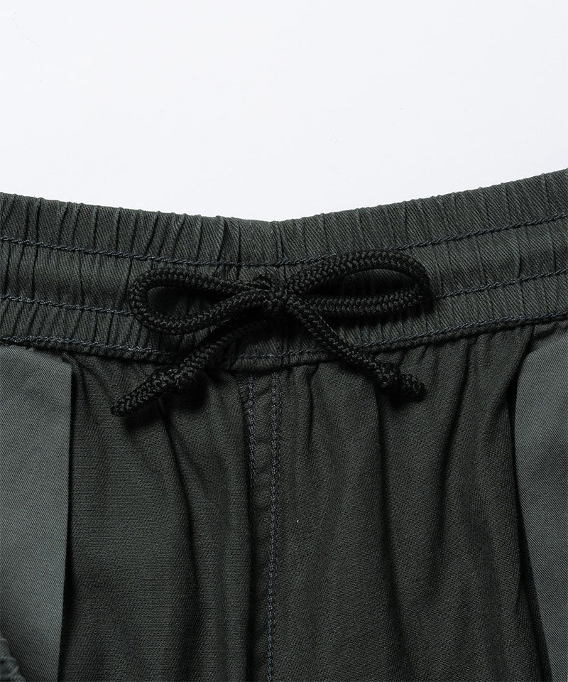 Close-up inside view of shadow colored Gramicci Swell Pant with drawstring on a light-tone background.
