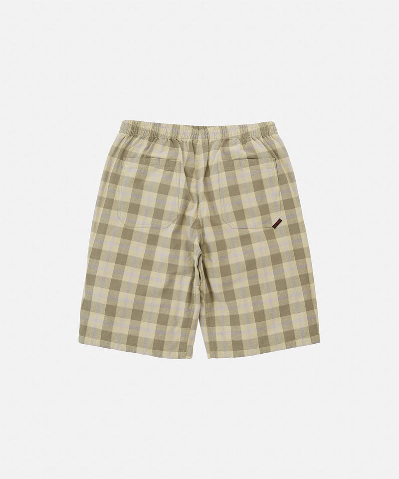 Back view of shadow plaid colored Gramicci Swell Short Shadow Plaid on a light-tone background.
