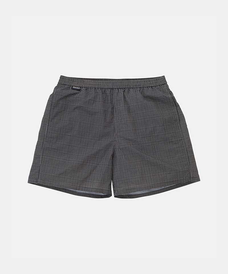 Black Gramicci Grid Swim Short with a belt against a light-tone background.