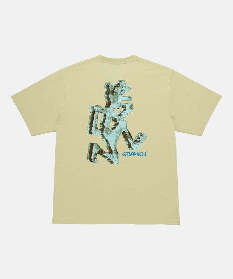 Back view of a Gramicci lime colored Ice Sculpture Tee with a running man graphic against a light tone background.