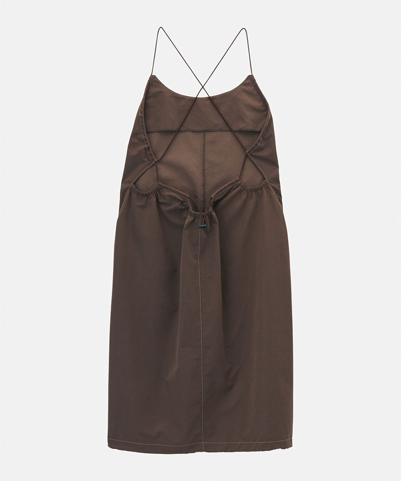 Back view of a Gramicci Women's Woven Milton Dress in the color walnut on a light-tone background.