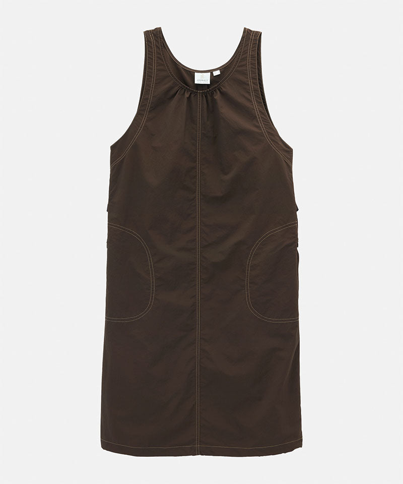 Chocolate colored Gramicci Nylon Dress against a light-tone background.