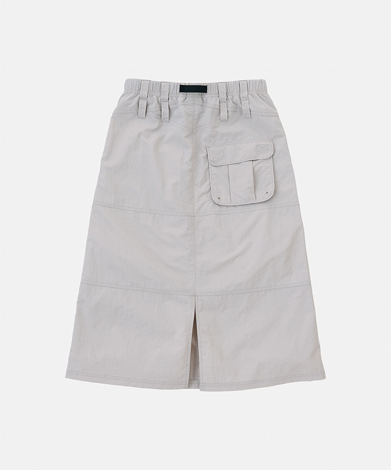 Back view of a Gramicci ecru colored Nylon Utility Skirt against a light-tone background.