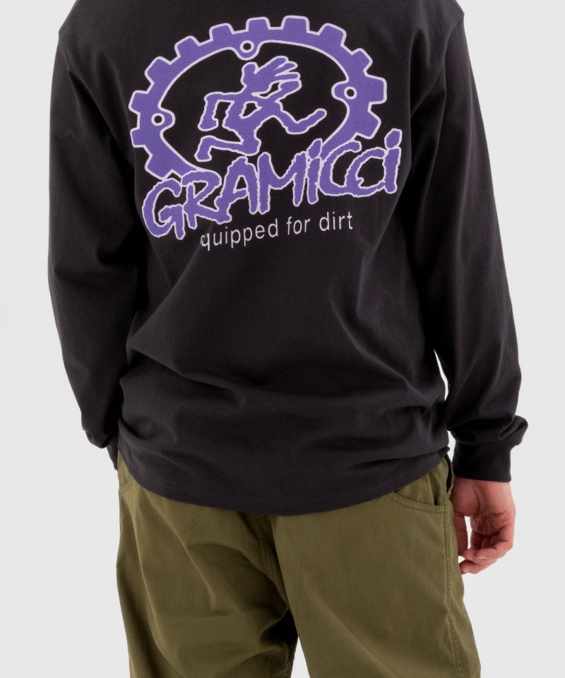 Back view of a model wearing olive green Gramicci Pants and a Gramicci Dirt Long-Sleeve-Tee on a light-tone background.