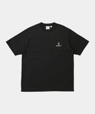 Black t-shirt with a small white GRAMICCI logo on a white background