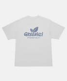 Back view of a Gramicci smoke colored Gramicci Greenicci Tee with a grey Greenicci graphic against a light-tone background.