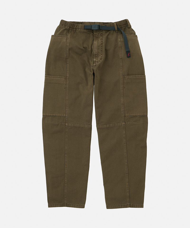 Bark pigment colored Gramicci Woman's Voyager Pants with a belt against a light-tone background.