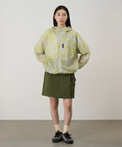 Model wearing a Gramicci G-Skort in the color olive and a black shirt on a light-tone background.