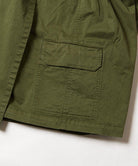 Close-up of Gramicci G-Skort in the color olive against a light-tone background.