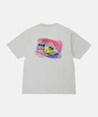 Back view of a Gramicci mist colored Bass Tee with a graphic against a light-tone background.